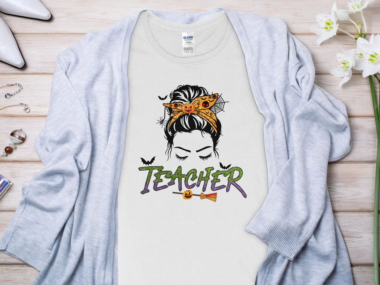 This Halloween Teacher T-Shirt is crafted from high-quality fabric in sizes to fit all shapes and size - Creations Unlimited