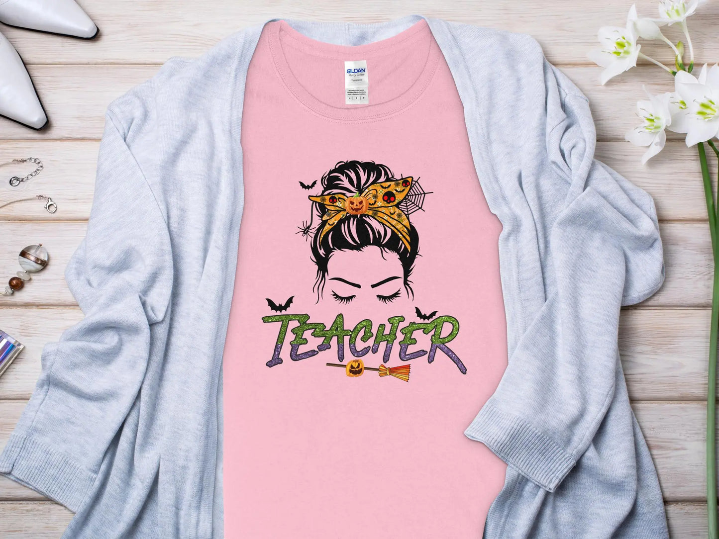 This Halloween Teacher T-Shirt is crafted from high-quality fabric in sizes to fit all shapes and size - Creations Unlimited